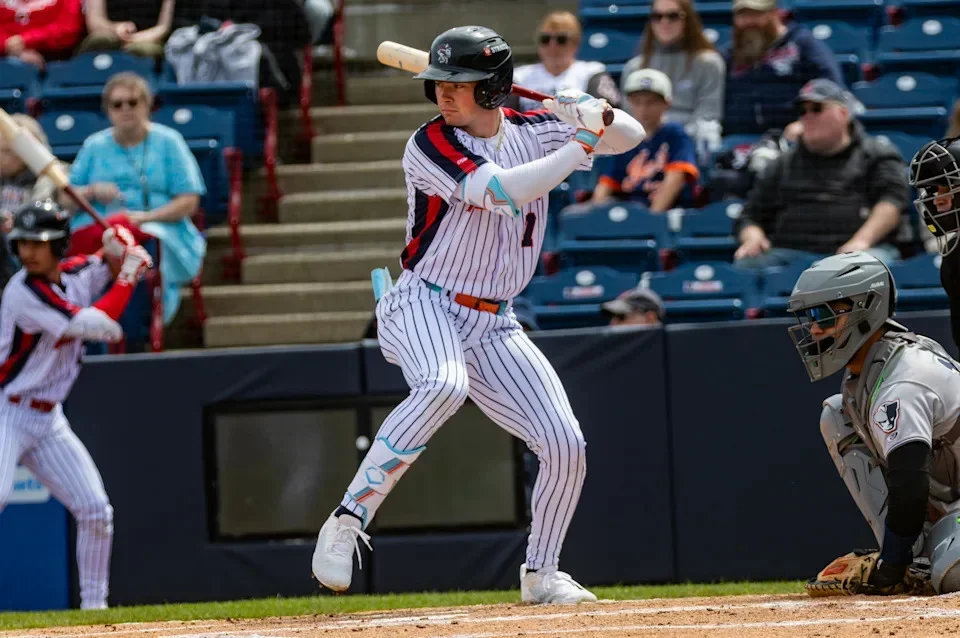 A.J. Ewing prepares to swing in a home white Binghamton Rumble Ponies uniform